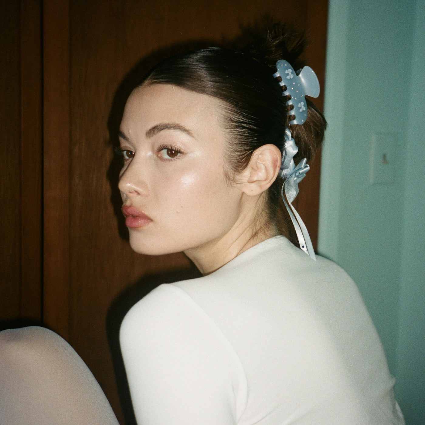 model wearing Darling Scrunchie in Baby Blue with sweetheart clip