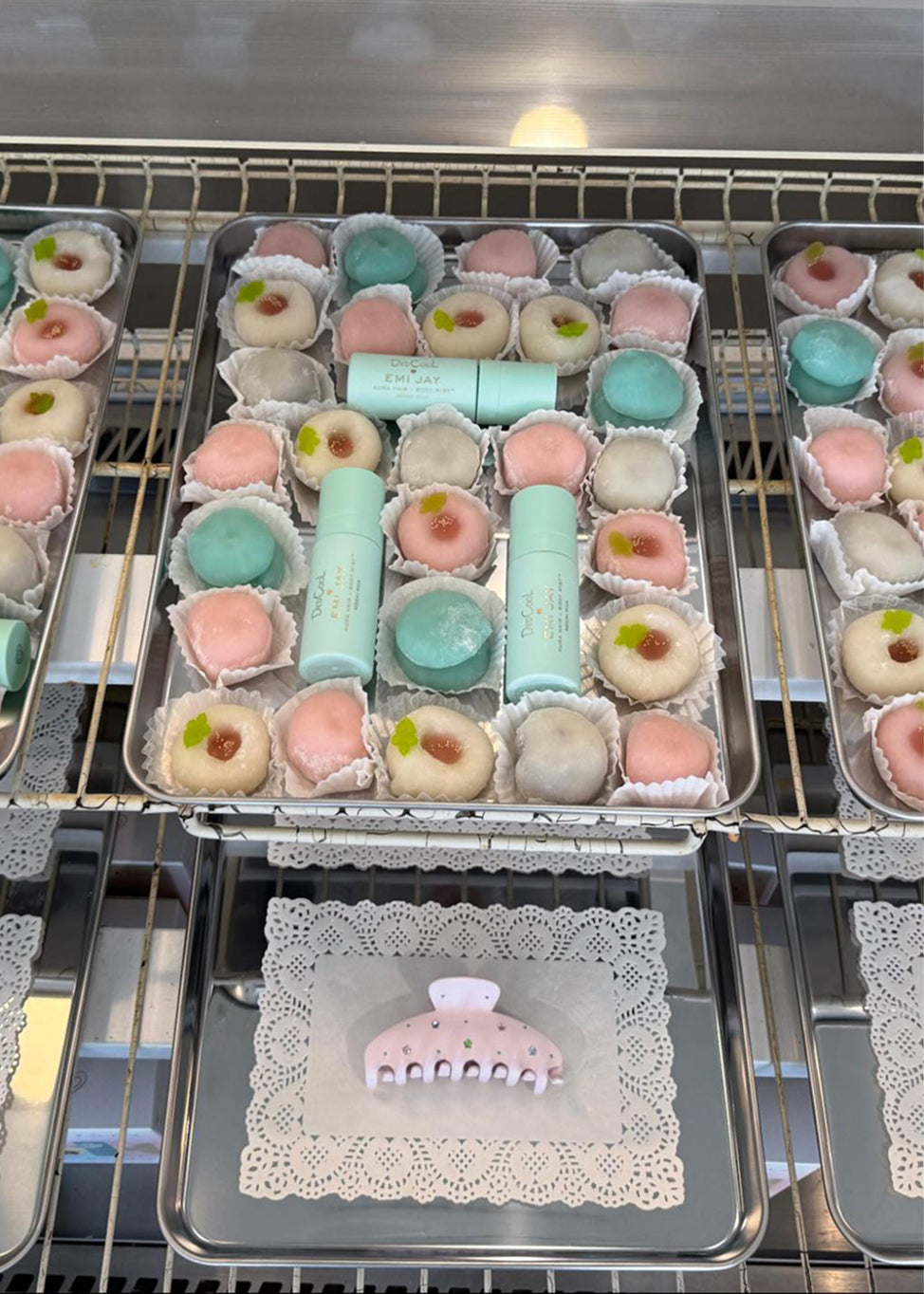 assorted mochi treats on trays with dedcool x emi jay products