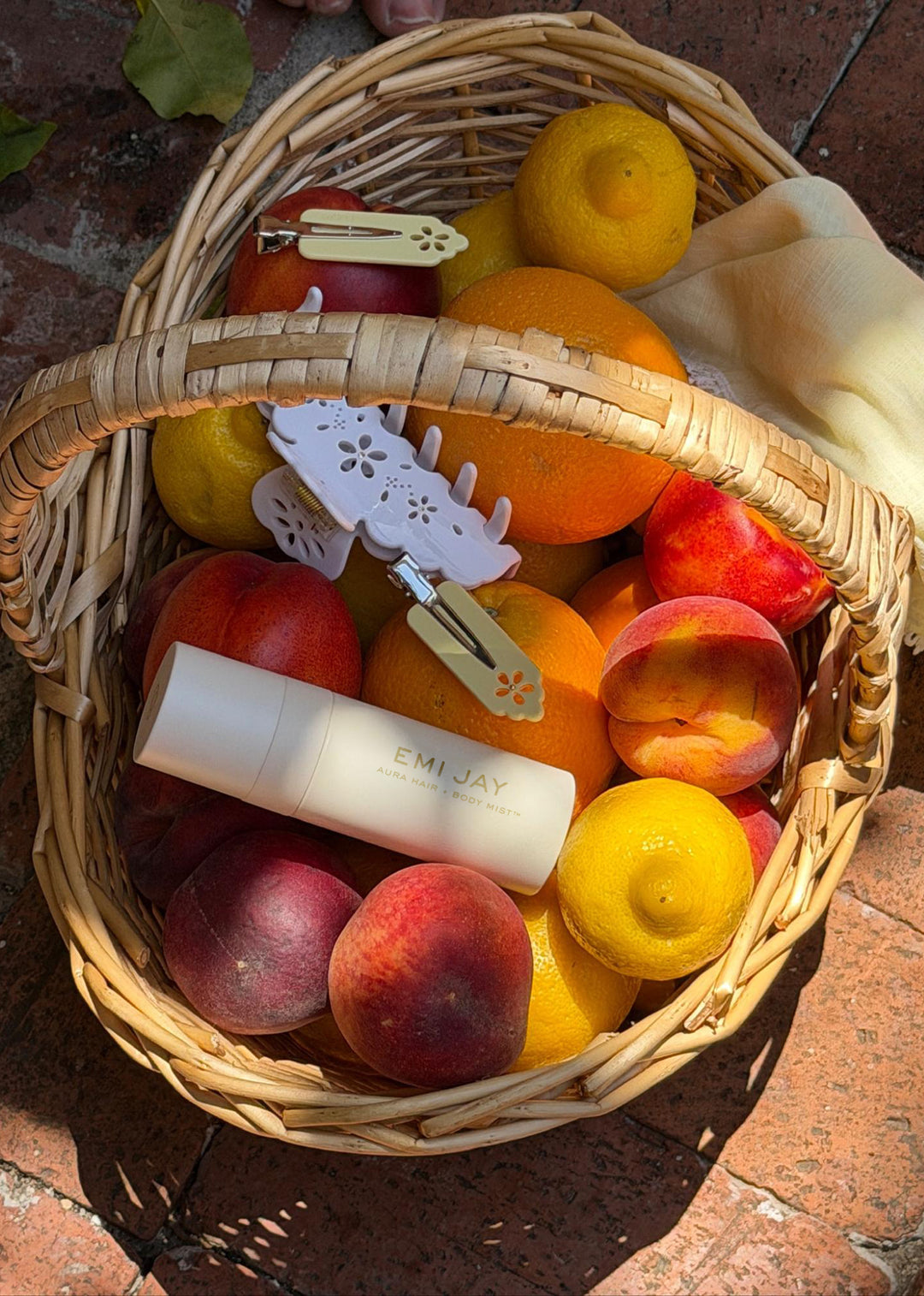 basked of fruit with assorted emi jay hair care and accessories