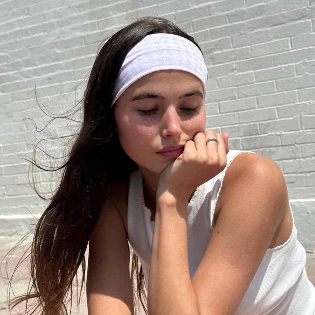 model with chin on hand wearing Infinity Headband in Baby Pink Gingham in hair