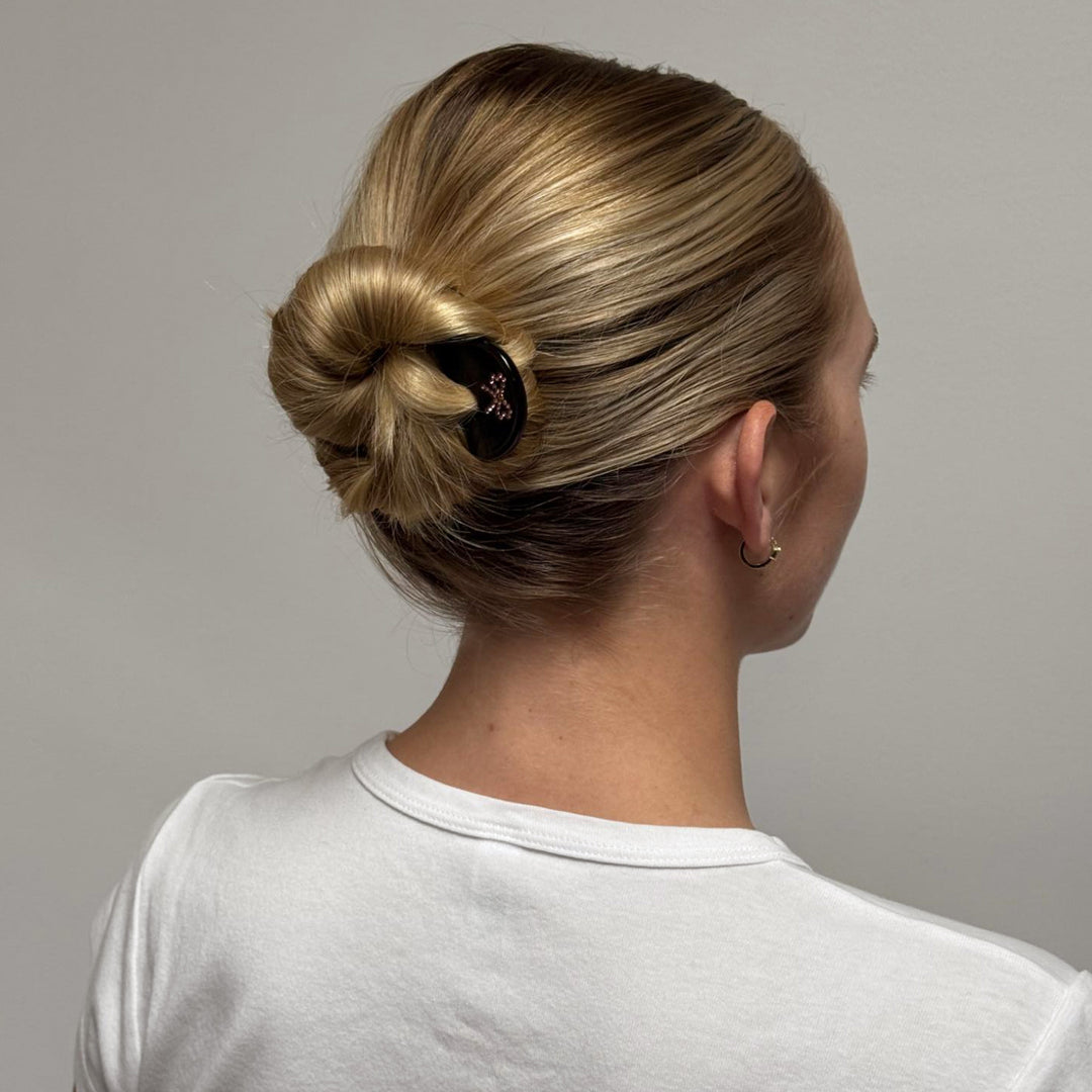 model wearing Iconic Velvet Bow Barrette in Cabernet in hair
