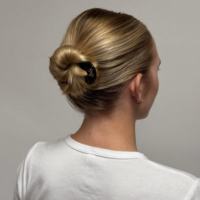 model wearing Iconic Velvet Bow Barrette in Cabernet in hair