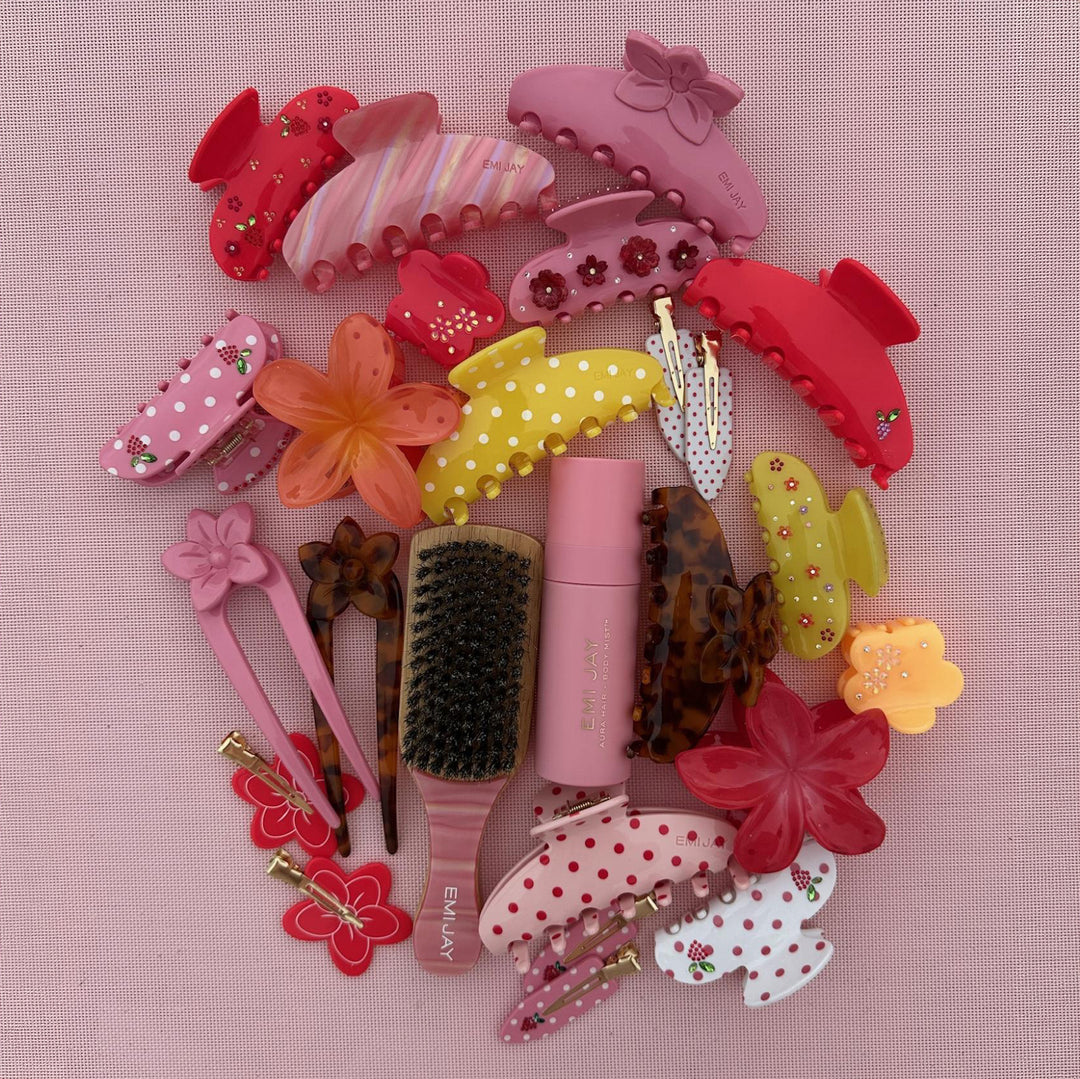 aura hair + body mist in lychee baby with assorted emi jay hair accessories and brush