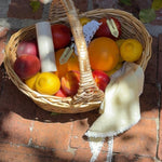 basket of fruit with emi jay hair care and accessories