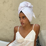 model wearing Heavenly Hair Towel in Milk on head