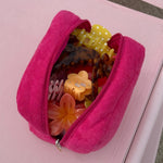 Midi Blossom Clip in Peach Bloom in pouch with assorted hair accessories