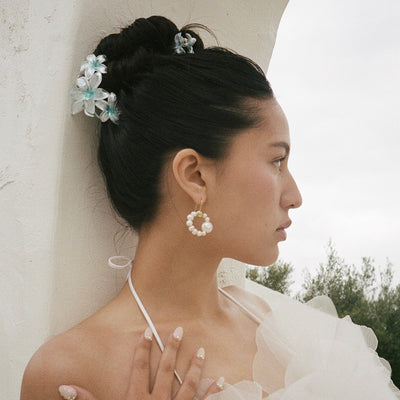 model wearing Miss Super Bloom Clip in Aqua Pearl in hair