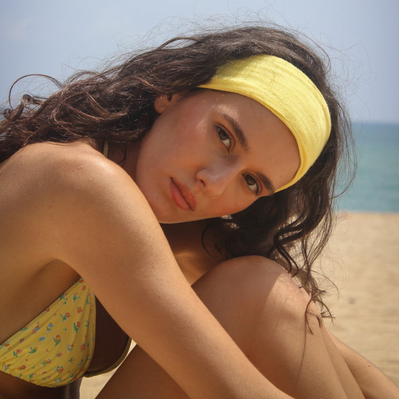 closeup of model wearing Pointelle Headband in Passionfruit
