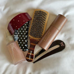 assorted emi jay hair care and accessories