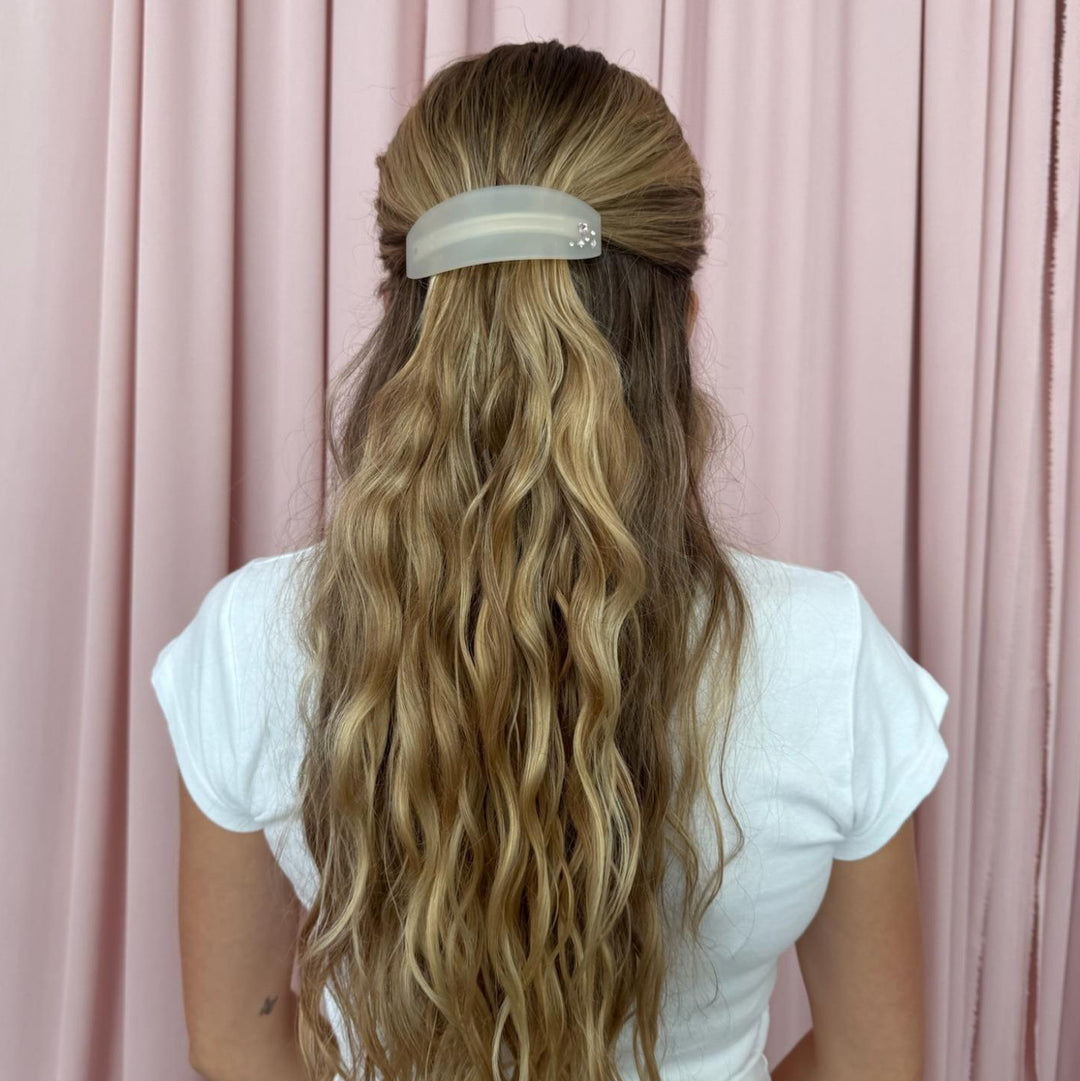 model standing in front of pink curtain with Ponytail Barrette in Grey Smoke in hair