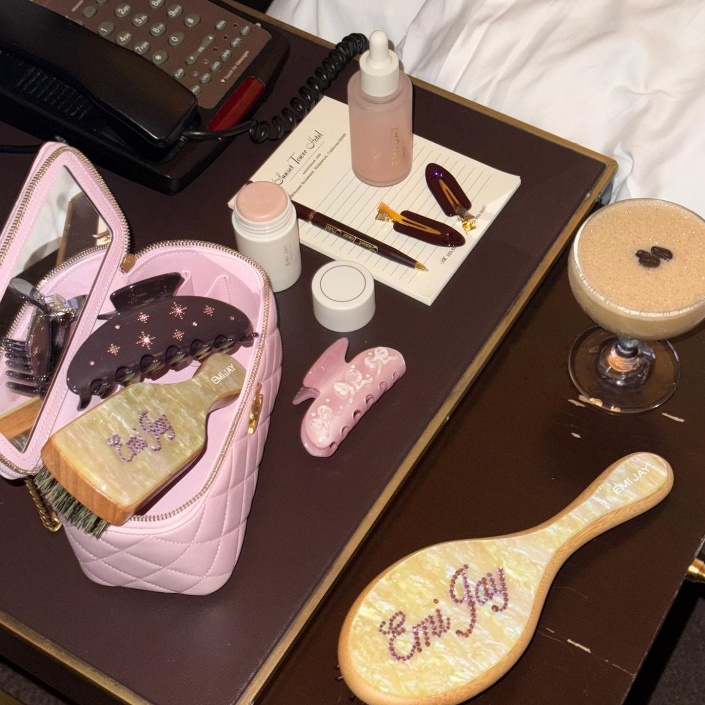 assorted emi jay hair care and accessories on hotel table