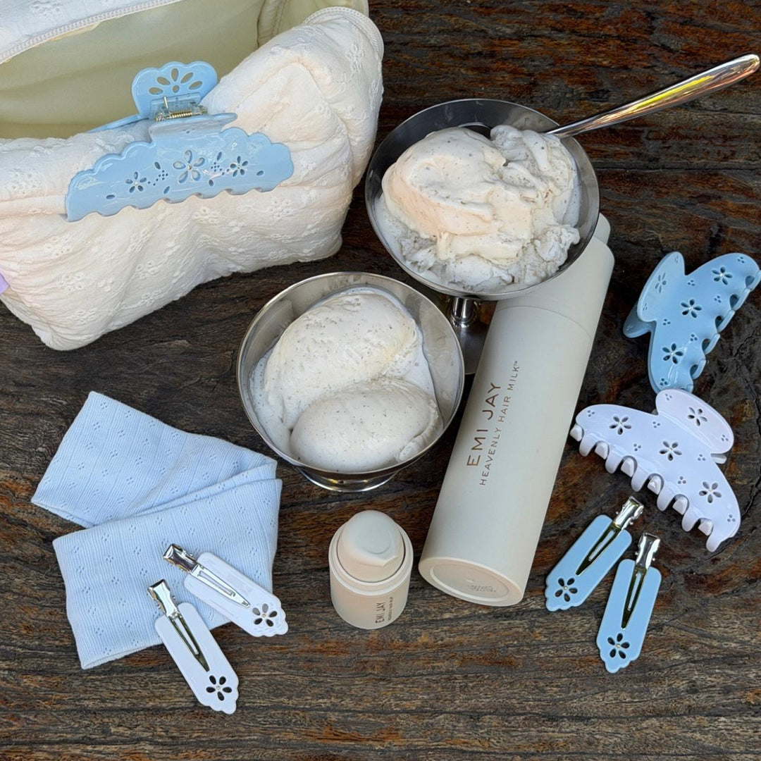 Popstar Clips in Blue Mist Eyelet on table with ice cream in dish, heavenly hair milk, pouch, and hair accessories