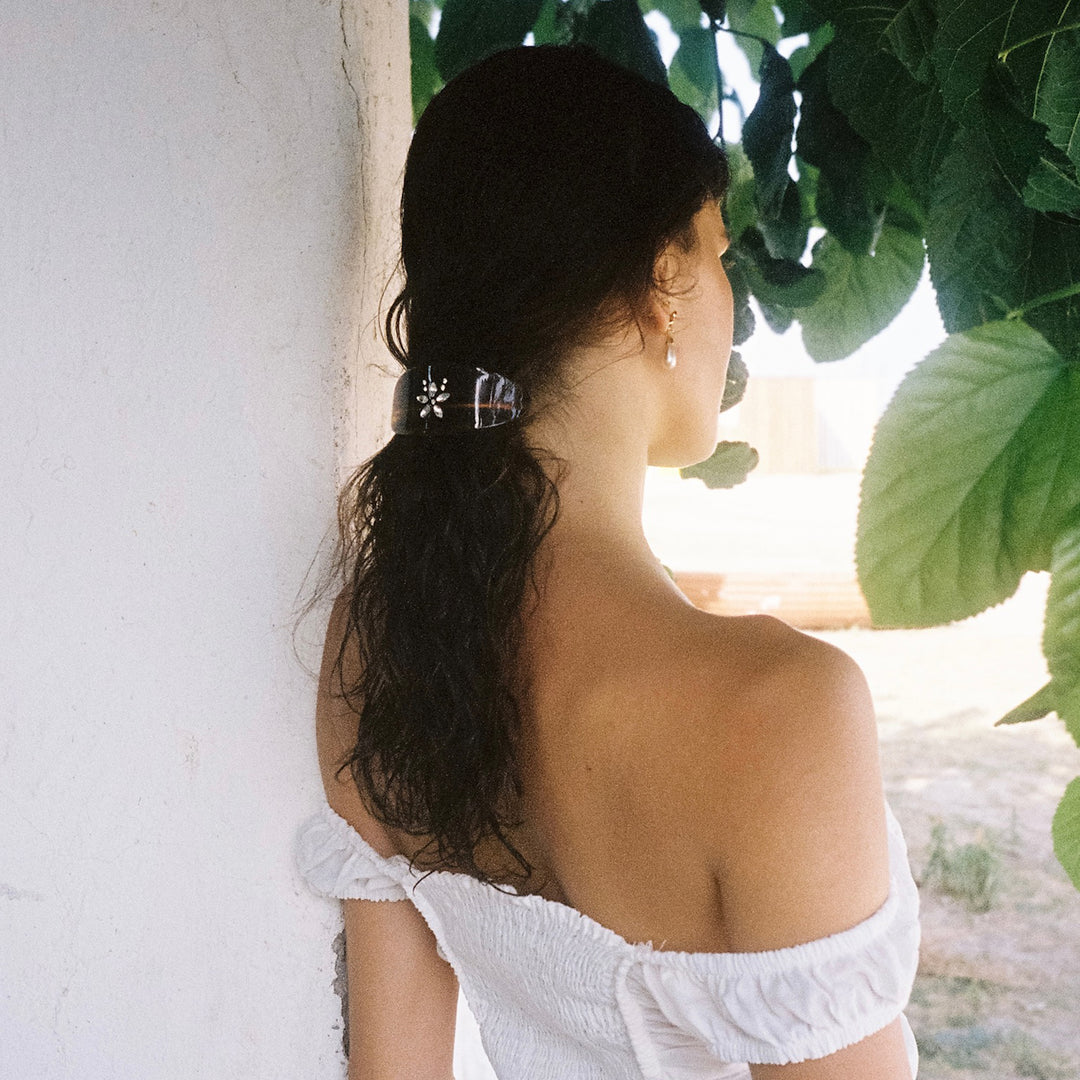 model wearing Ponytail Barrette in Tortoise Gardenia
