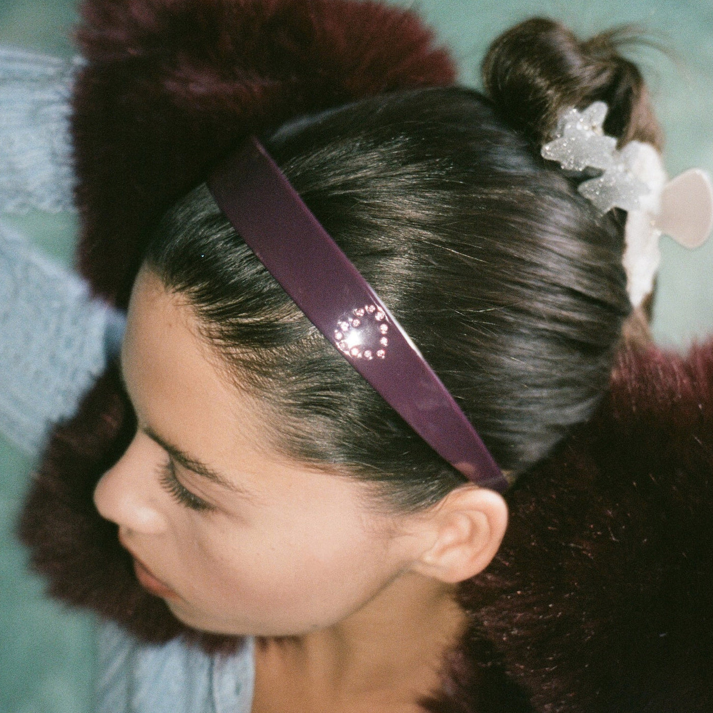 closeup of model wearing Starlet Headband in Rose Violet