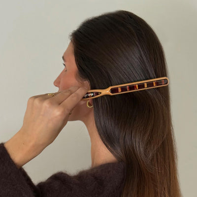 model brushing hair with Styling Brush in Nightcap