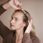 Model using Styling Brush in Toasted Sugar in hair.