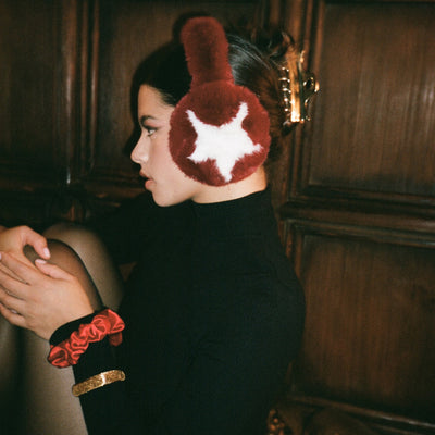 side view of model wearing Sugar Muffs in Red Currant