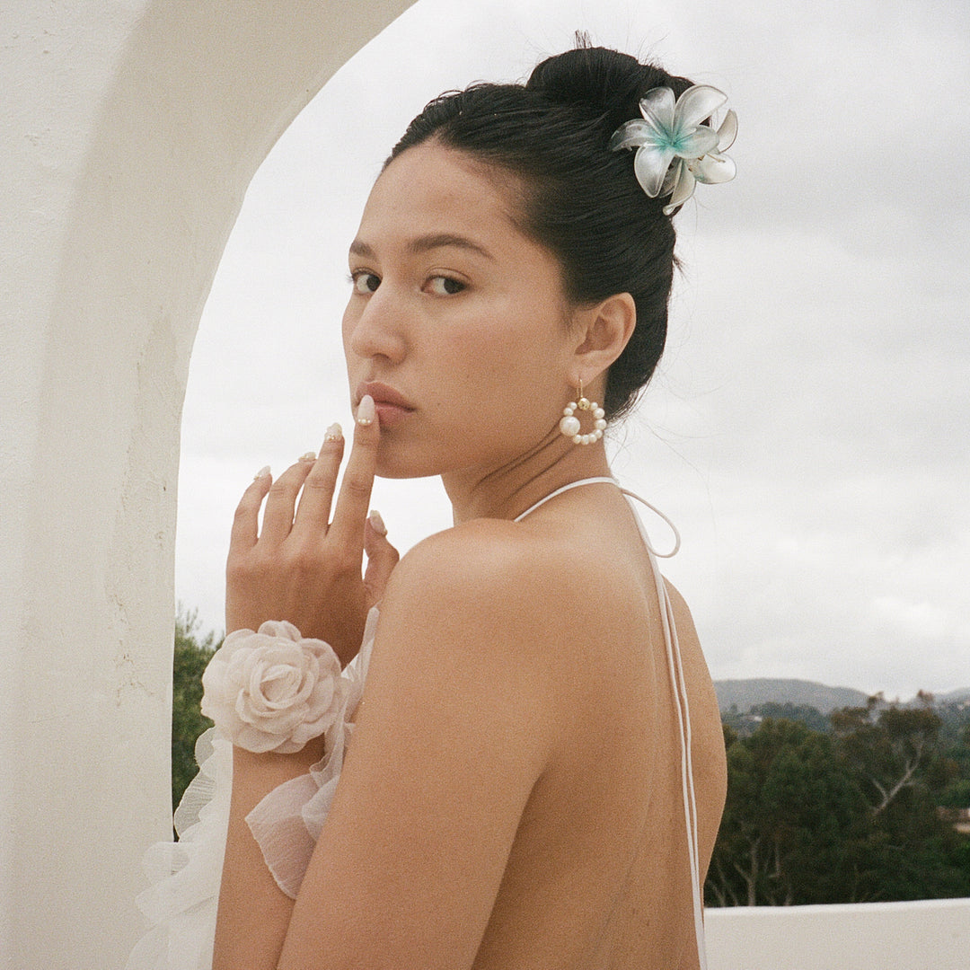 model wearing Super Bloom Clip in Aqua Pearl
