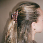 Closeup view of model wearing Sweetheart Clip in Cozy Cabin in hair.
