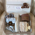 assorted emi jay hair care and accessories in vanity case