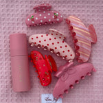 Aura Hair + Body Mist in Lychee Baby with assorted Emi Jay hair clips on Heavenly Hair Towel