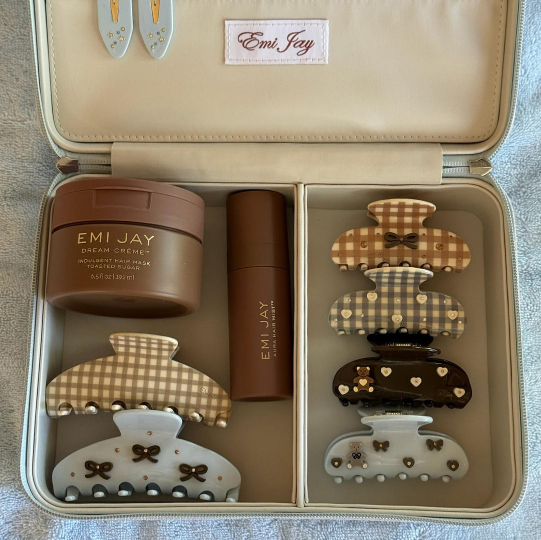 assorted emi jay hair care and accessories in vanity case