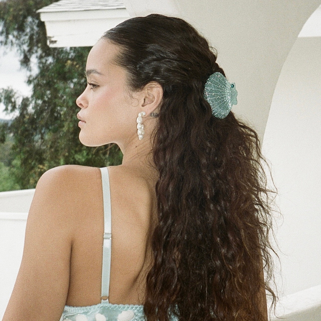model wearing Sweet Shell Clip in Bubbles in hair