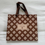 Toasted Sugar Gift Bag on bed.