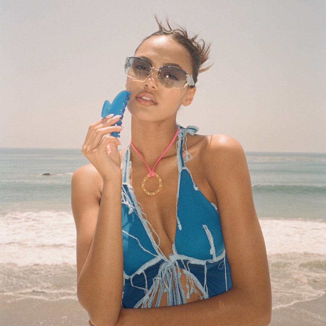 model holding Big Effing Clip in Blue Crush