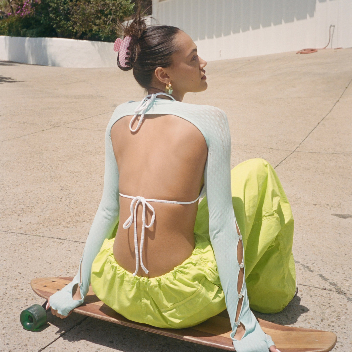 Model on skateboard wearing Big Effing Clip in Skate Princess