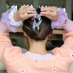 model wearing Printed Scrunchie in Wisteria on wrist
