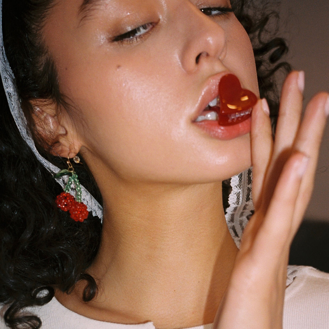 model with Baby Heart Clip Set in Cherry Kiss in mouth