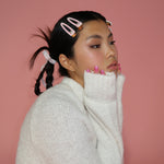 model with Barrette Set in Bundle Up in hair