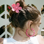 model wearing Big Daisy Clip in Hibiscus in hair