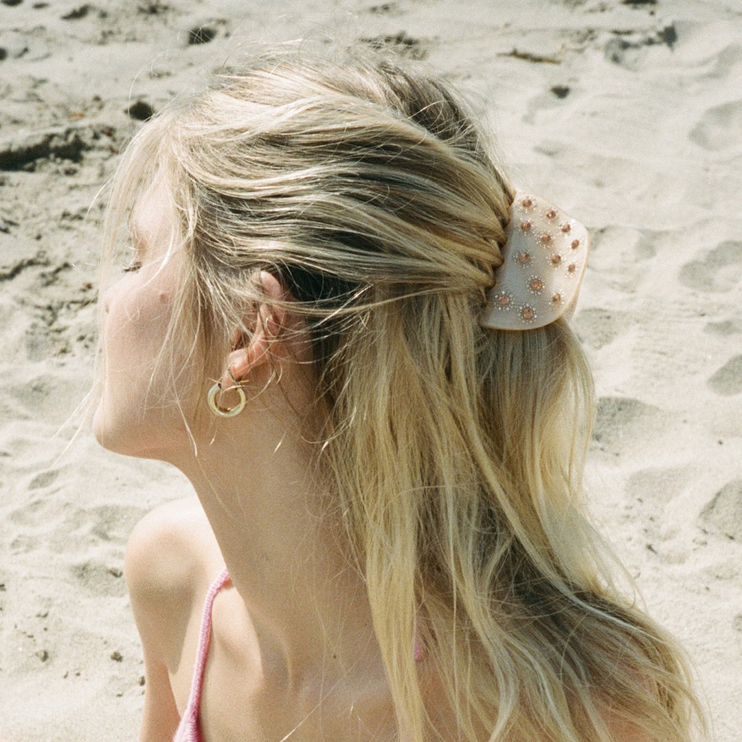 model wearing Luna Clip in Peach in hair