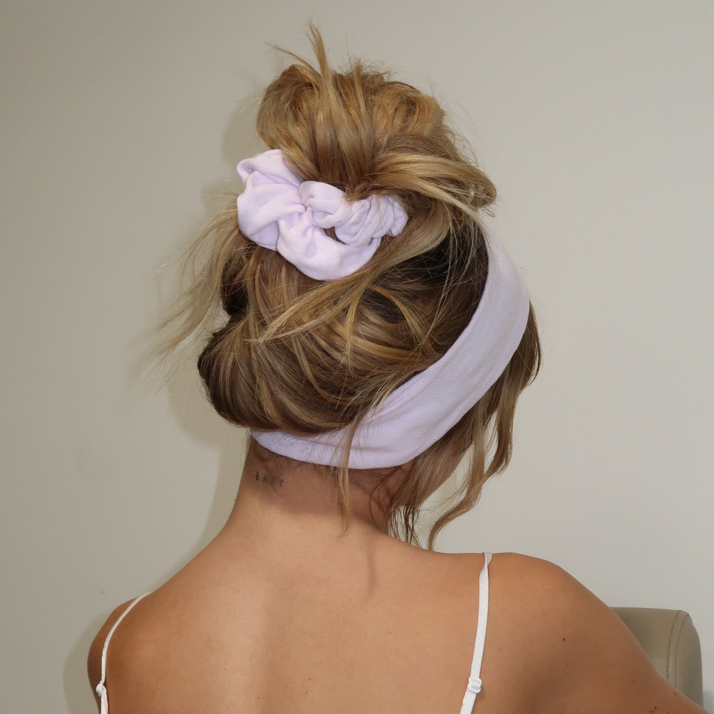model wearing pointelle scrunchie in frosted lilac