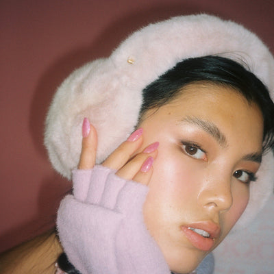 closeup of model wearing Sugar Muffs in Frosted Pink