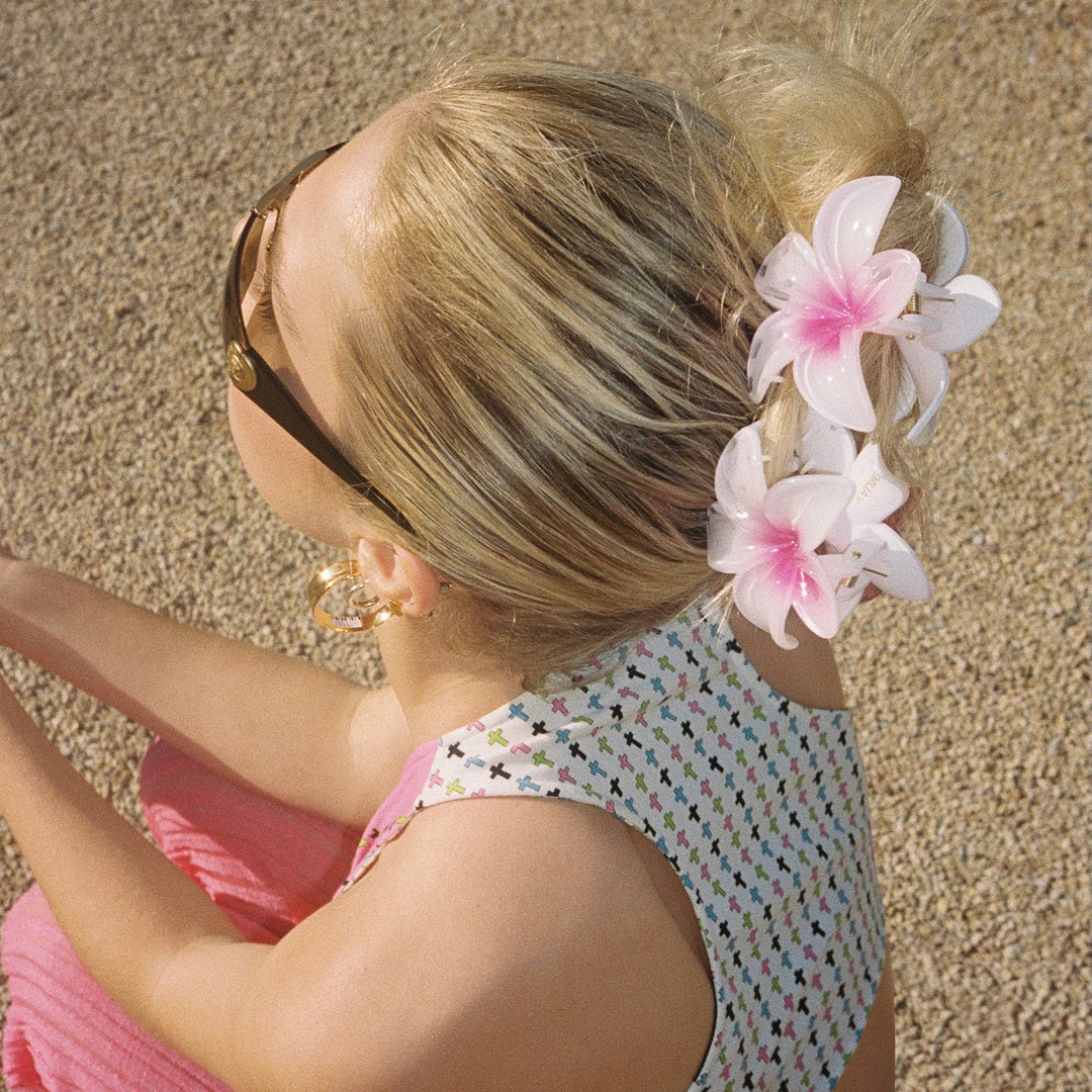 closeup of Super Bloom Clips in Wild Orchid in hair