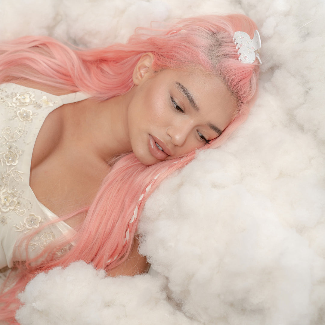 model laying down with Sweetheart Clip in Tea Party in hair