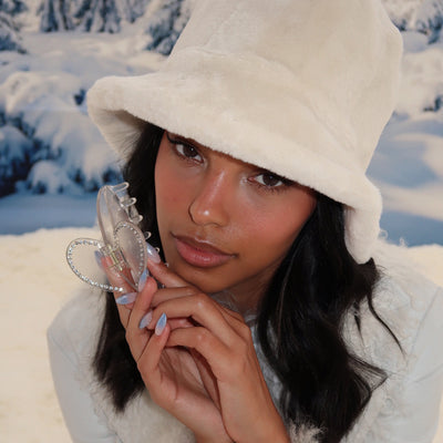 model wearing Teddy Bucket Hat in Après Ski + Cozy Clip in Snowed In